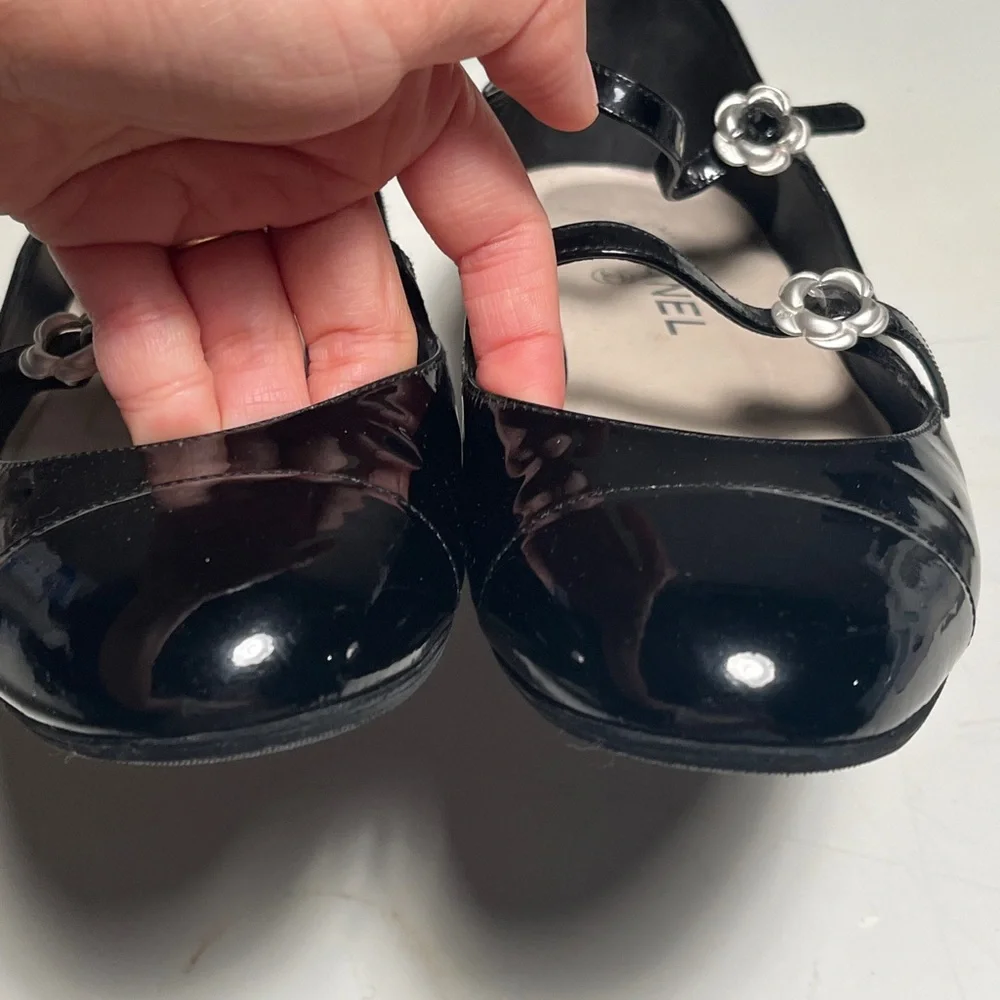 CHANEL Black Patent Leather Flats with Silver Floral Accents - Picture 2 of 14